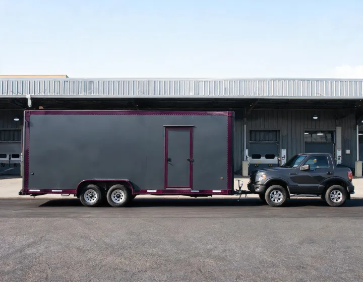 Custom bumper pull cargo trailer at a commercial loading yard